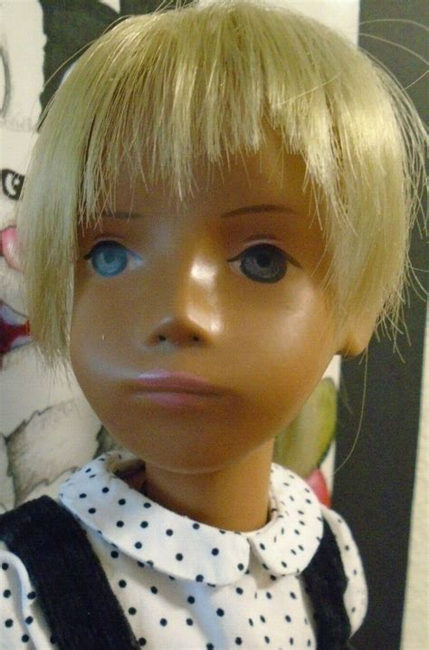 blonde mid 60 s slate eyed sasha with longer length fringe to sides of face sasha doll side