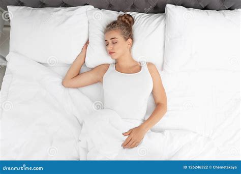 Beautiful Woman Sleeping On Comfortable Pillow In Bed At Home Stock