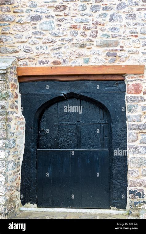 Typical Traditional Wooden Cottage Door On Old Stone Building At