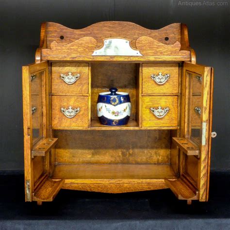 This antique white set of kitchen cabinets enchants with its traditional design, fitting perfectly well into classic interiors. Victorian Oak Smoker's Cabinet - Antiques Atlas