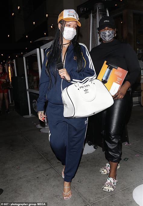 Rihanna Keeps It Casual Cool In A Navy Tracksuit And Prada X Adidas Bowling Bag In Beverly Hills