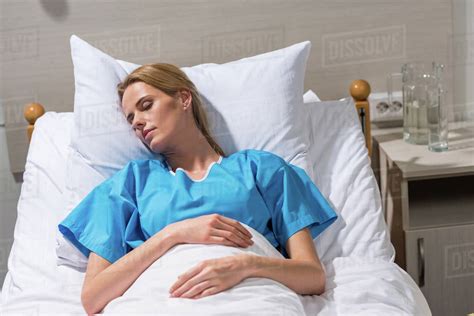Sick Woman Sleeping On Hospital Bed Stock Photo Dissolve