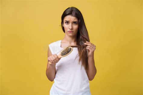 Woman Hand Holding Her Long Hair With Looking At Damaged Splitting Ends