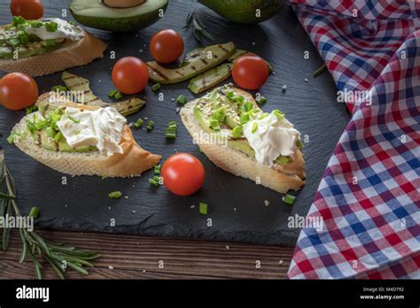 Bread With Slices Of Avocado And Cream Cheese Stock Photo Alamy