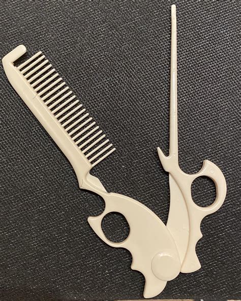 Scissor Action With Comb And Tapered Stick That Closes To The Base Of