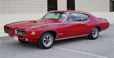 A 1969 Pontiac Gto Judge In A Matador Red Paint Scheme With Hideaway