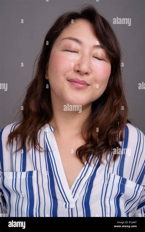 Face Of Mature Beautiful Asian Woman With Eyes Closed Stock Photo Alamy