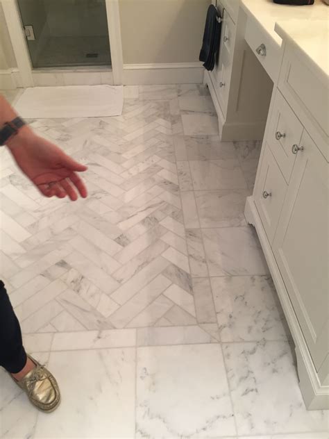 Herringbone Pattern Inset Surrounded By 12x12 White Carrara Floor Tiles
