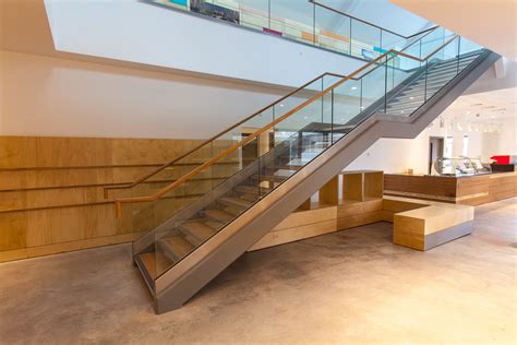 Freestanding Structural Stair With Glass Balustrades With An Oak