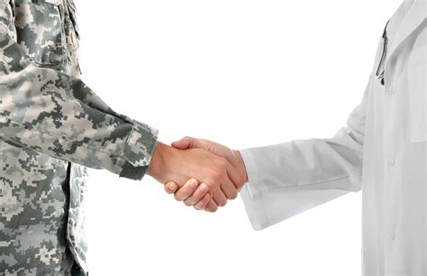 Soldier And Doctor Shaking Hands Isolated On White Will M Helixon