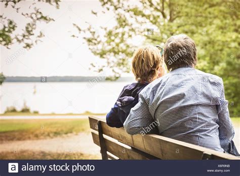 Couple Park Bench Lake High Resolution Stock Photography And Images Alamy