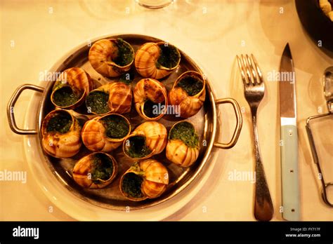 Burgundy Style Snails Served In Lescargot Montorgueil Restaurant In