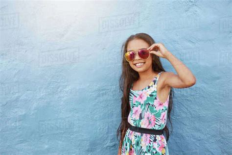 Portrait Of Stylish Babe Girl With Sunglasses Preteen Girl Posing Against Blue Wall With Copy