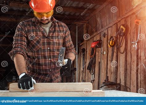 Carpenter Hammer Stuck Into A Wooden Beam Stock Photo Cartoondealer