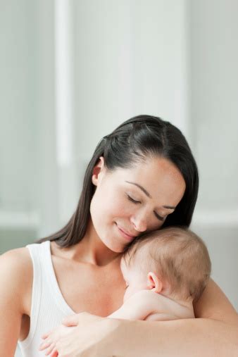 Smiling Mother Holding Baby Stock Photo - Download Image Now - iStock