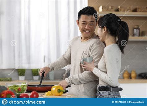 Loving Chinese Man Cooking For His Beautiful Wife Stock Photo Image