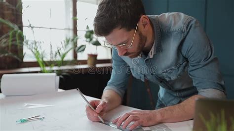 Architect Working On Blueprint With Spesial Tools And Pencil Close Up
