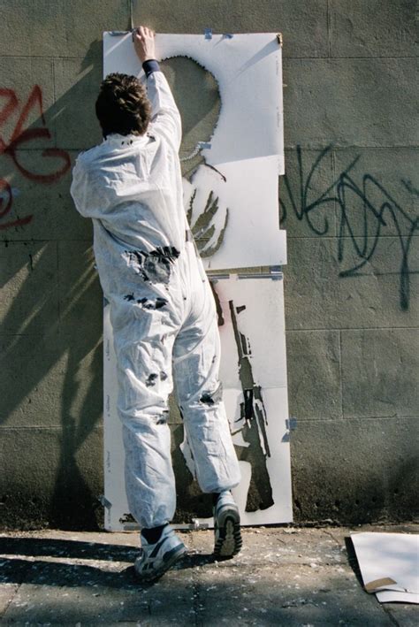 banksy s former dealer is releasing a book of never before seen photos of the street artist in