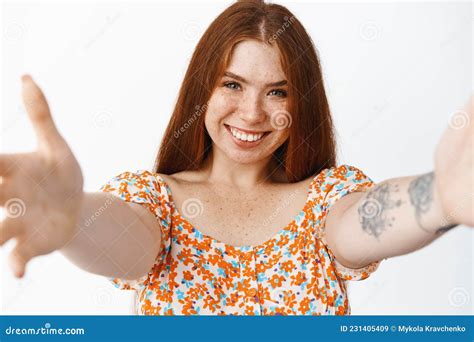 Close Up Of Gentle Happy Redhead Girl Reaching To You Stretching Out Hands For Hug Smiling