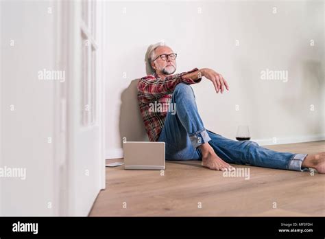Barefoot Man Relaxing On The Floor At Home Stock Photo Alamy