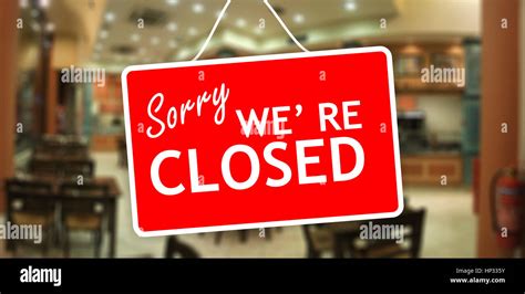 Sorry We Are Closed Sign Hanging On A Glass Storefront Stock Photo Alamy