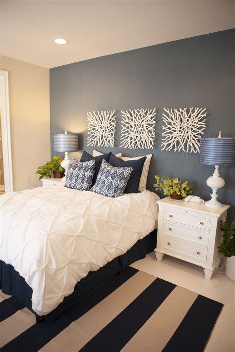 Elegant Guest Bedroom With Navy Walls And Striped Rug