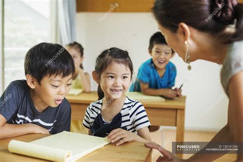 Teacher Talking To Children — Boys School Stock Photo 130741740