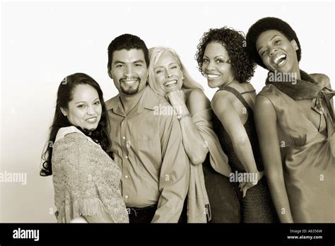 Portrait of five people standing in a row and smiling Stock Photo - Alamy