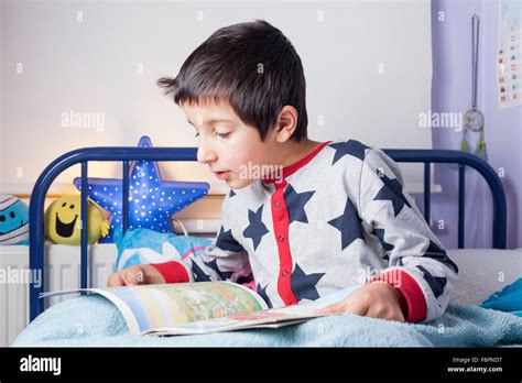 Boy Reading Bedtime Story Stock Photo Alamy