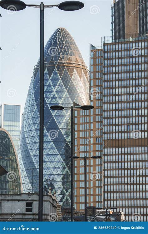 The Gherkin And Modern Buildings With Blue Sky In Background On Sunny