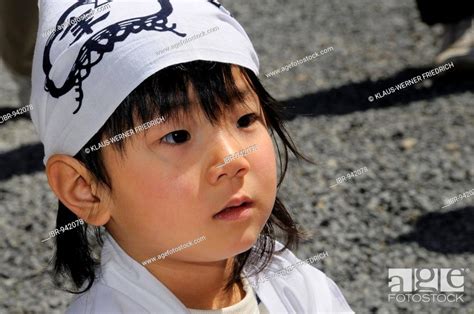 Head Of A Young Japanese Boy In Traditional Costume For The Procession