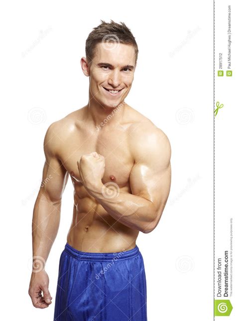 Muscular Young Man Flexing Arm Muscles In Sports Outfit Stock Photo