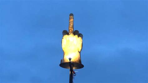 It just takes some practice. Man Builds Giant Middle Finger Statue In Dispute With Town ...