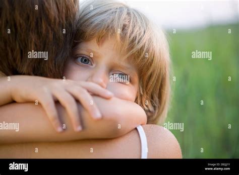 Little Girl Hugging Her Mother Stock Photo Alamy