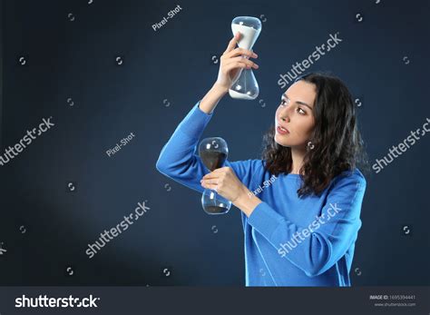 Woman Hourglasses On Dark Background Time Stock Photo 1695394441