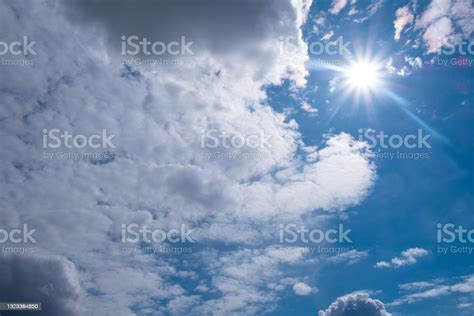 White Sun With Clouds On Blue Sky Stock Photo Download Image Now