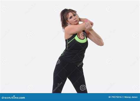 Attractive Middle Aged Woman In Sports Gear Stretching Her Arm Stock