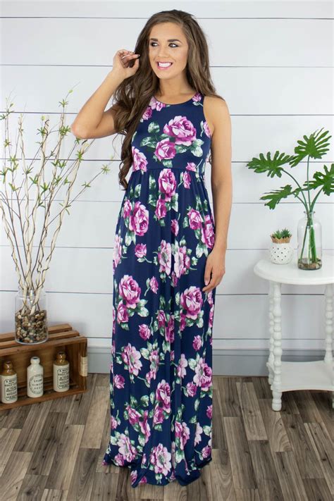 This Gorgeous Navy Floral Maxi Dress Is Complete With A Racerback Hidden Pockets And Showcases