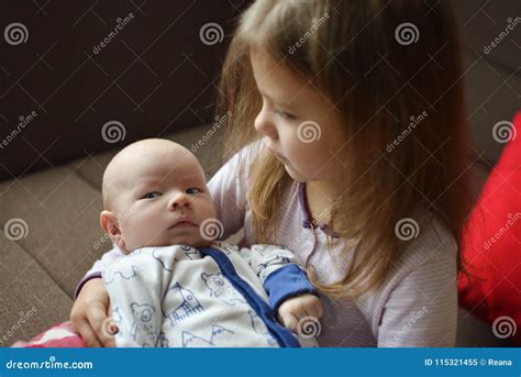 Sister Holding Her Newborn Brother Stock Image Image Of People