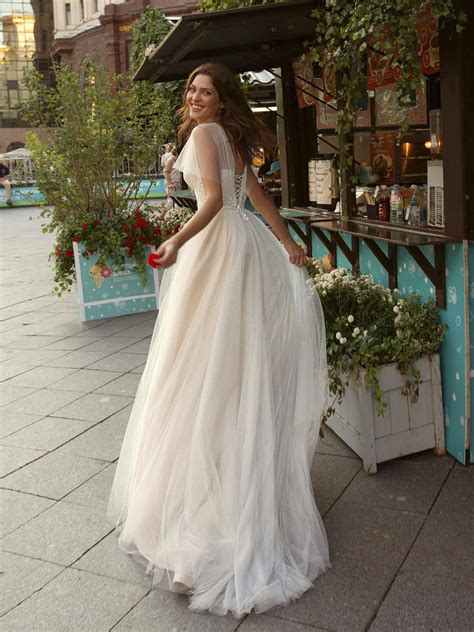 Check spelling or type a new query. Papilio A-line wedding gown with butterfly sleeves