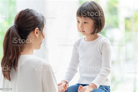 Young Japanese Mother And Daughter Playing Stock Photo Download Image