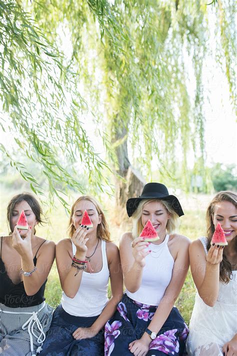 Female Friends Eating Watermelon Outside In Nature By Stocksy Contributor Jovana Rikalo