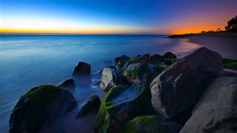 2560x1440 Rocks Ocean Nature Sunset Sky Sea Blue