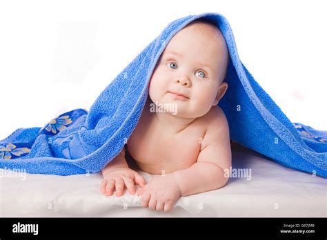 A Beautiful Baby Under A Blue Towel Stock Photo Alamy