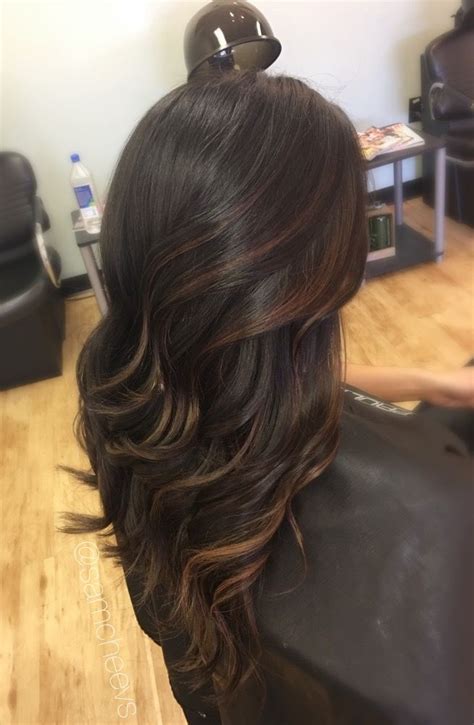 Also, consider using a hair curler to style the locks in a sweet, girly way. Caramel highlights for dark hair types // light brown ...