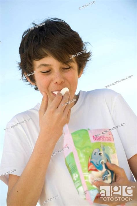 ADOLESCENT SNACKING Stock Photo Picture And Rights Managed Image Pic BSI Agefotostock