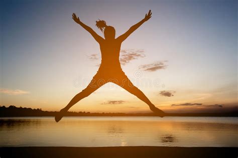 Silhouette Of Happy Woman Jumping Stock Photo Image Of Healthy