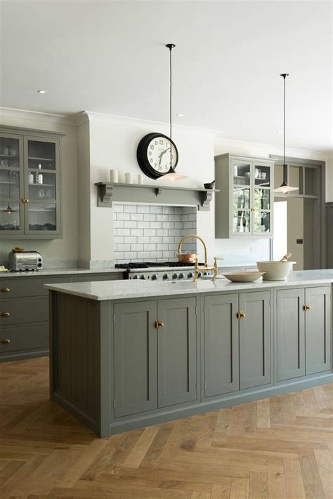 If you do just one thing to upgrade your kitchen, make it this. Muted grey cabinets, aged brass hardware - Kitchen Ideas