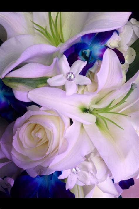 white lillies white roses blue dendrobium orchids and stephanotis bridal bouquet bridal