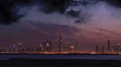 Dubai Skyline With Burj Khalifa At Sunset Wallpaper Backiee
